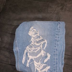 Distressed Light Blue Denim Jeans